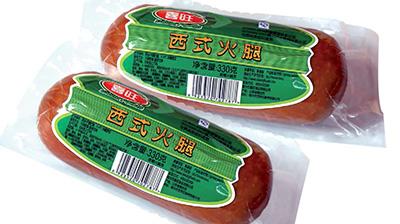两袋喜旺西式火腿及绿色标签上的条形码